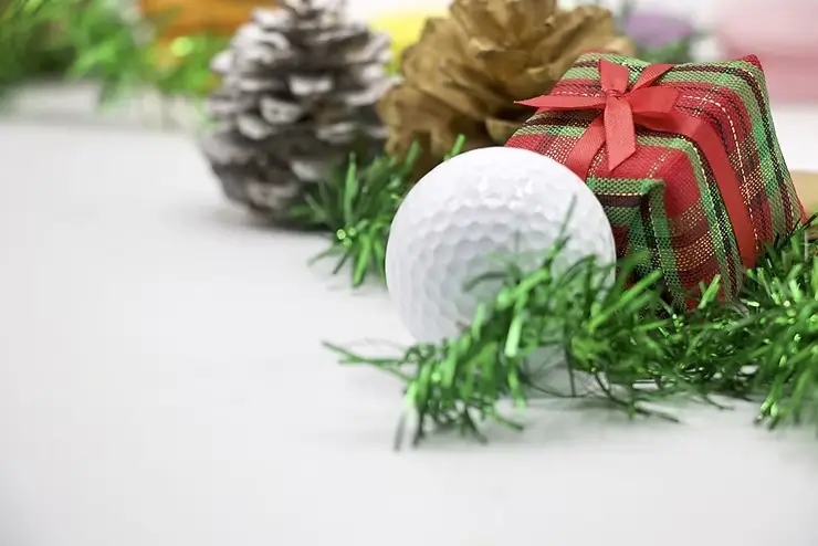Golf ball with chrismas presents