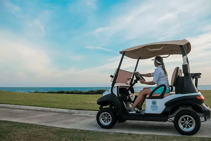 Woman sitting in a golf cart